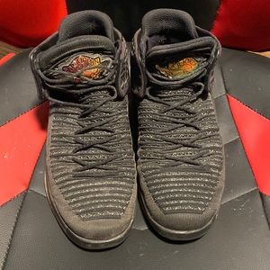 Black, Air Jordan’s. Size 9.5 Men. Comes with laces already on.